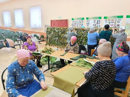 Тепло рук в маскировочной сети